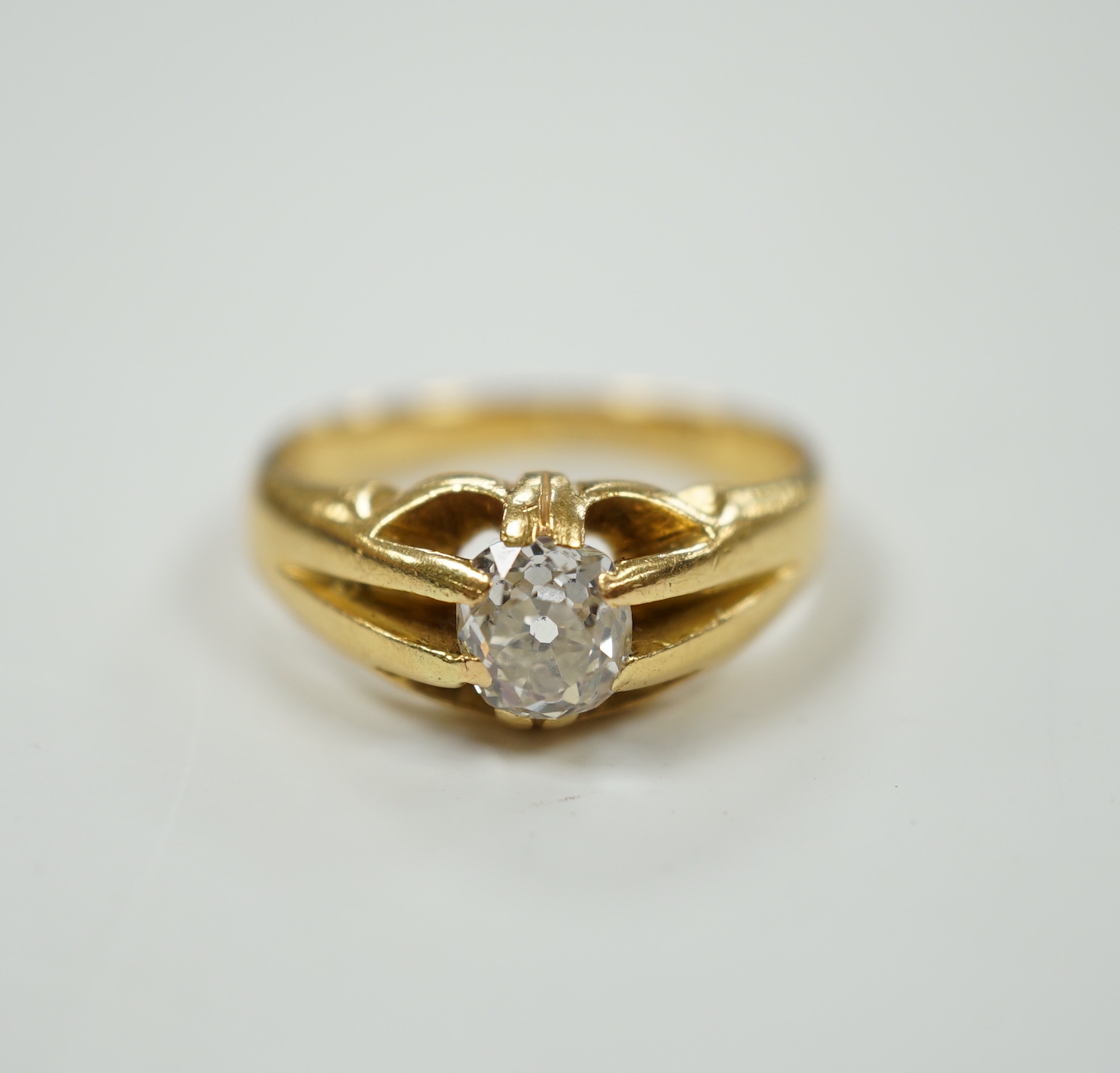 An 18ct and claw set solitaire old cushion cut diamond ring, size P/Q, gross weight 6.7 grams.